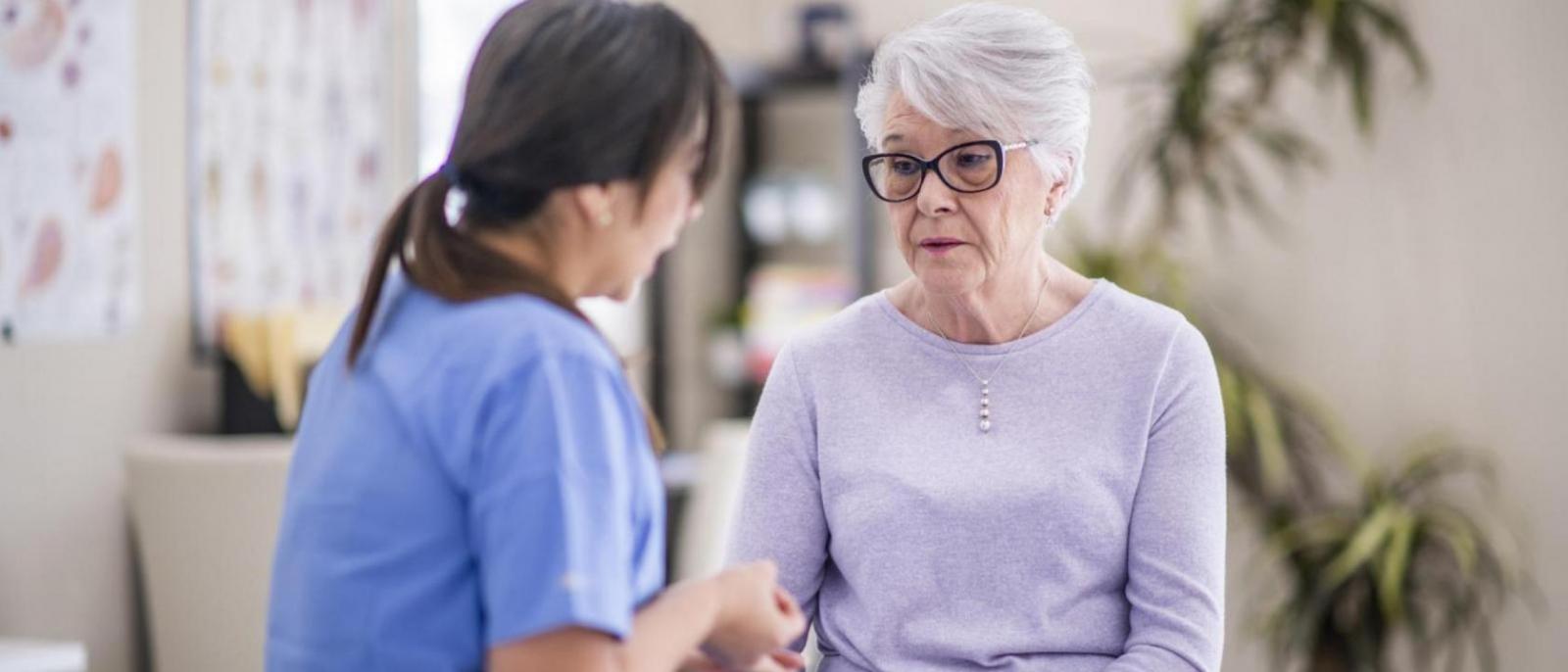 A senior woman talks to her doctor about some recent struggles she is going through.
